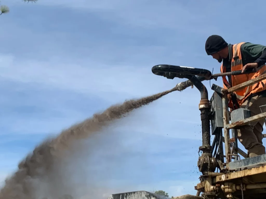 Spraying EcoMax on a recent job site