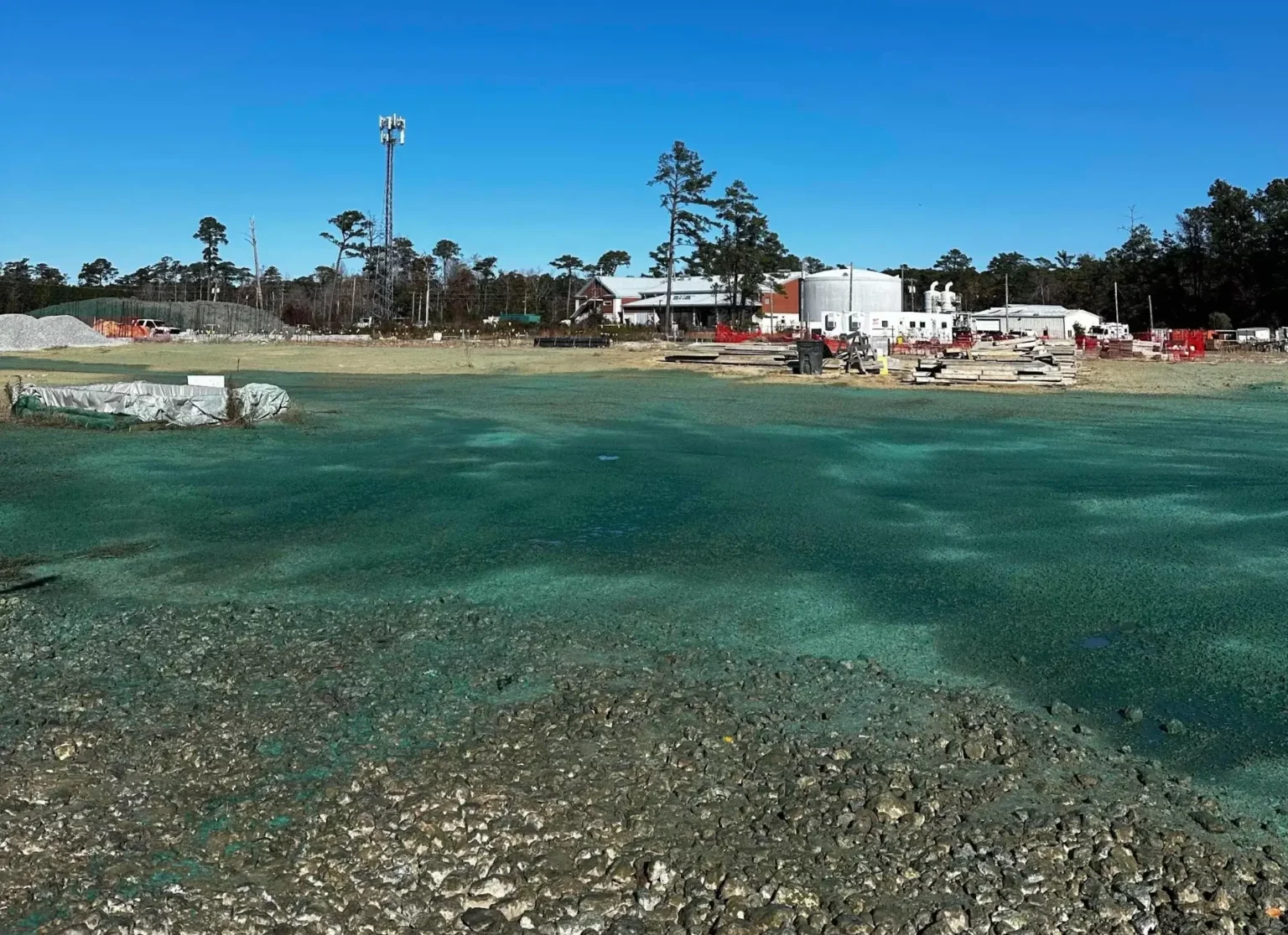 Hydroseeding was applied across disturbed areas to promote rapid stabilization