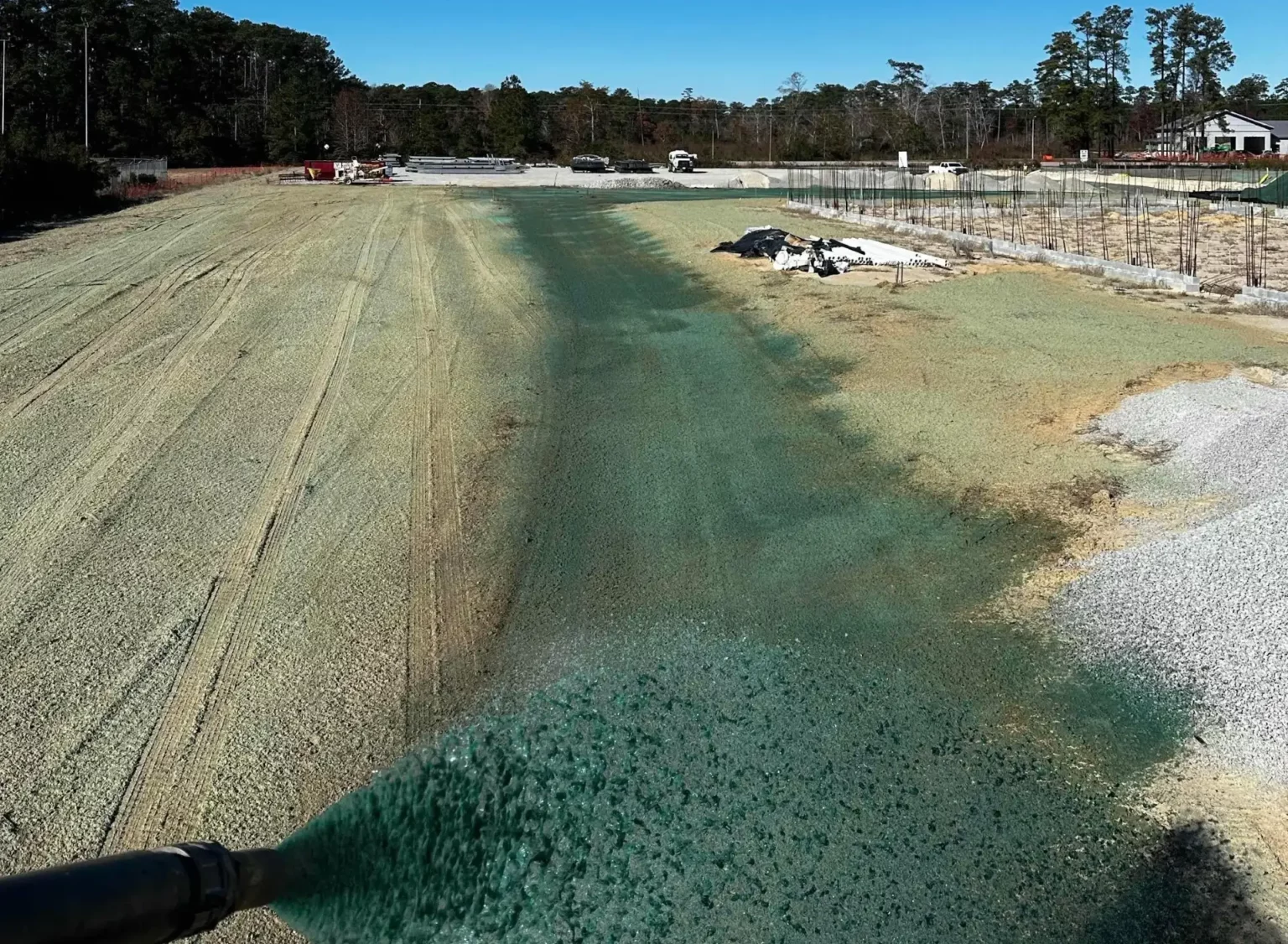 Hydroseeding was applied across disturbed areas to promote rapid stabilization