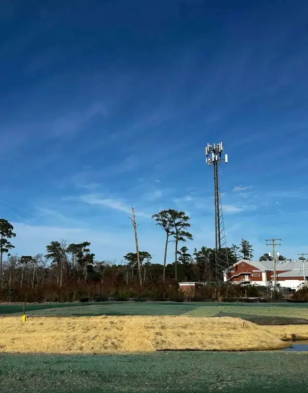 Stabilizing sediment basin slopes using hydroseeding and erosion control matting to prevent erosion and support vegetation growth.
